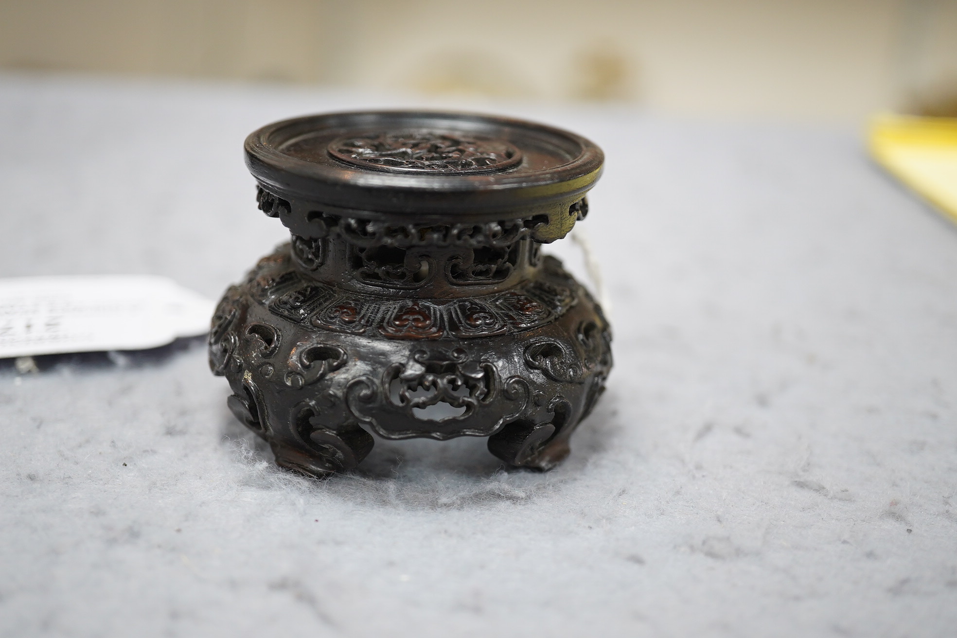 A Chinese huanghuali scholar’s stand, 18th/19th century, and a small reticulated zitan stand, 19th century